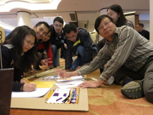 Team members sharing and developing creative ideas during a collaborative session