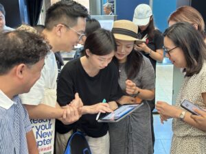 Team collaborating on a problem-solving challenge in Hong Kong