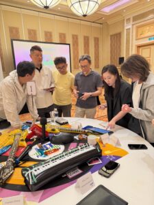 Corporate team creating a song during a collaborative team experience
