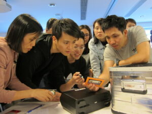 Corporate team using AI tools collaboratively to create more sustainable ways of working