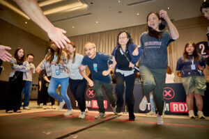 Colleagues participating in a high-energy TeamRox team challenge